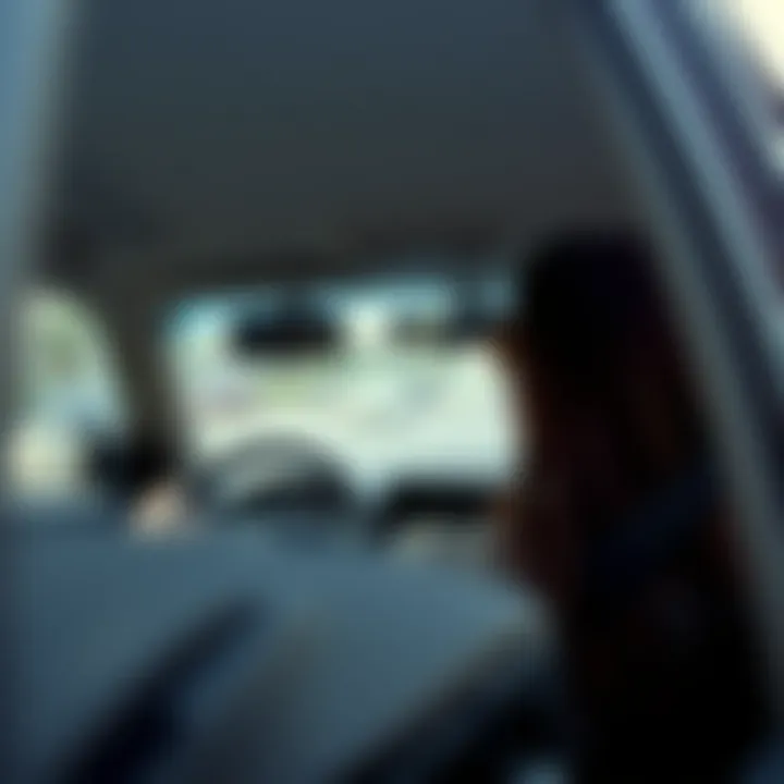 Interior view of a taxi showcasing the driver's seat with personal touches.